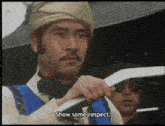 a man in a turban says show some respect in a video