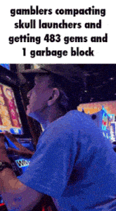 a man is playing a slot machine and getting 483 gems and 1 garbage block ..