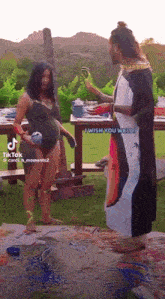 a woman in a bathing suit is standing next to a man in a white robe and says i wish you welli