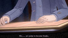 a man in a blue suit is sitting at a table and says we are going to become freaks