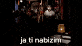 a man with a beard is making a funny face and saying `` ja ti nabizim '' .