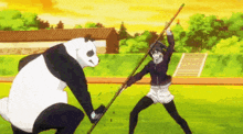 a panda bear is holding a stick in front of a girl .