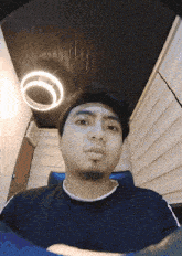 a man with a beard looks at the camera