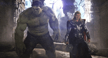 hulk and thor are standing next to each other in a ruined building
