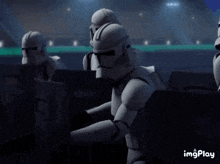 a couple of stormtroopers standing next to each other with the word imgplay in the bottom right corner