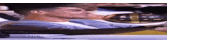 a man is laying in a chair with his eyes closed and a blurred background .