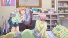 a girl with a flower in her hair stands next to another girl