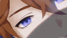 a close up of a person 's eye with blue eyes .