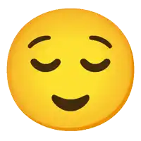 a smiley face with its eyes closed and a smile