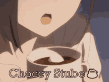 a girl is holding a cup of hot chocolate with the words choccy stube written on it