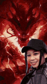 a woman in a black hat is smiling in front of a dragon