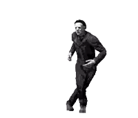 a man in a jumpsuit is dancing in a pixel art style and pointing at something .