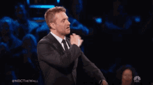 nbc nbc the wall nbc the wall gifs dusting off suit