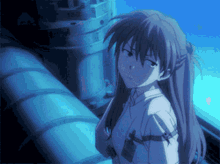 a girl in a white shirt is standing next to a pipe