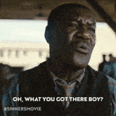 a man says oh what you got there boy on a poster