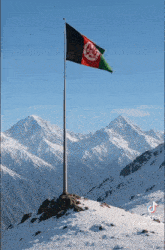 a flag on top of a snowy mountain with mountains in the background and a tik tok logo