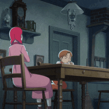 a woman in a pink dress sits at a table holding a child
