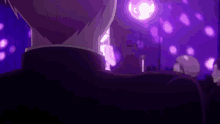 a man in a black suit stands in front of purple lights