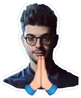 a man with glasses is praying with his hands together