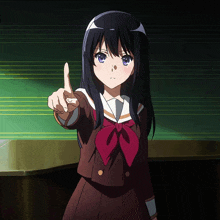 a girl in a school uniform is pointing at something