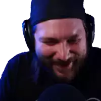 a man with a beard wearing headphones and a beanie