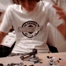 a person wearing a white converse all star t shirt