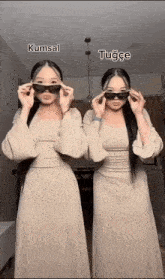 two women wearing sunglasses are standing next to each other with kumsal and tugce written above them