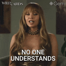 a woman in a gold dress says " no one understands " while sitting in a chair
