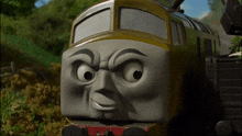 a close up of a cartoon train with a face that looks angry