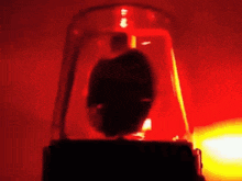 a red light with a silhouette of a person inside of it .
