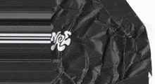 a piece of black paper with the word yes written on it