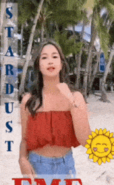 a woman in a red off the shoulder top stands on a beach with the words stardust written above her