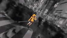 a girl in a yellow hoodie is flying through the air with a sword .