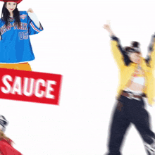 a woman in a blue new york 05 jersey holds a red sign that says sauce