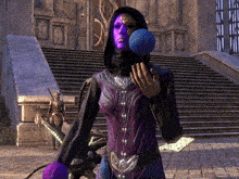 a woman in a purple and black outfit is holding a blue ball