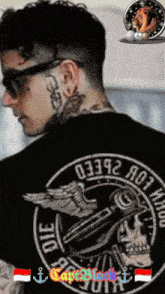 a man with a tattoo on his neck is wearing a black shirt that says capt black on it