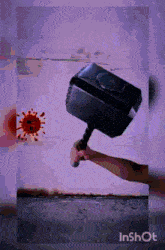 a person is holding a hammer in front of a virus on a wall ..