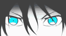 a close up of a person 's blue eyes with a black background .