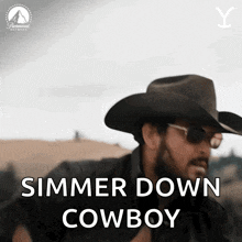 a man in a cowboy hat and sunglasses says " simmer down cowboy "