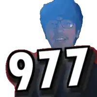 a man wearing glasses holds up the number 997
