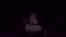 a close up of a person 's hand with a purple background that says ' a ' on it