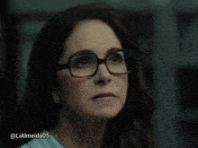 a woman wearing glasses has the username lialmeida05