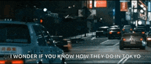 a car is driving down a street with the words " i wonder if you know how they do in tokyo " on the bottom