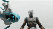 two action figures are standing next to each other