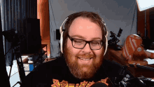 a man with glasses and a beard wearing a shirt that says ' samurai '