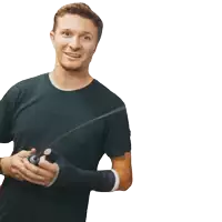 a man with a cast on his arm is holding something in his hands