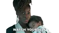 a woman holding a baby with the words watch yourself written below her
