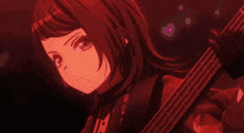 a girl is playing a bass guitar in a purple light