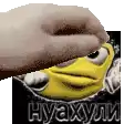 a hand is touching a cartoon character 's face with its finger .