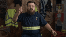 a man with a beard and glasses is pointing at the word you